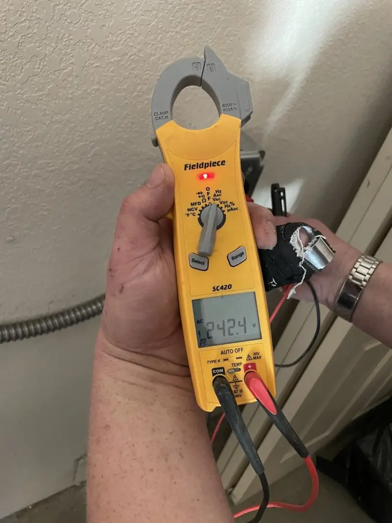 Voltage testing with clamp meter during Electrical Installation Services in Greenfield